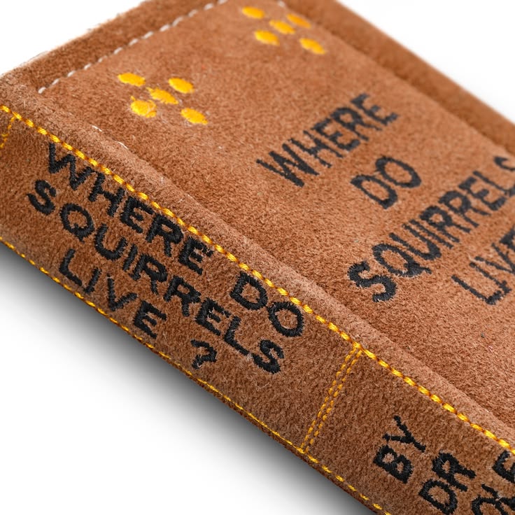 Where do squirrels live? Book dog toy